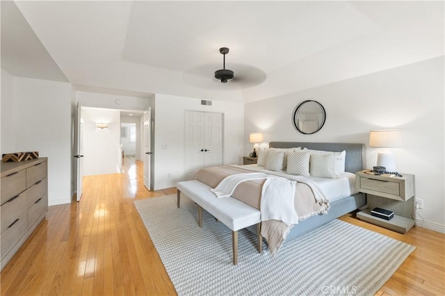 10 Cedarlake Unit 4, Irvine, CA 92614 - bedroom featuring baseboards, light wood-style floors, visible vents, and a closet