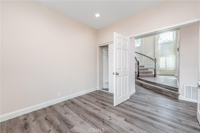429 Somerset Cir, Corona, CA 92879 - unfurnished bedroom with wood finished floors, baseboards, a closet, and recessed lighting