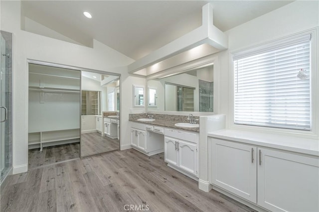 429 Somerset Cir, Corona, CA 92879 - full bath with a stall shower, vaulted ceiling, wood finished floors, double vanity, and recessed lighting