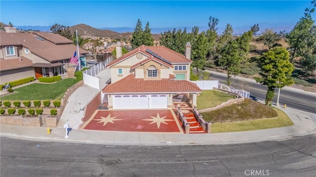 429 Somerset Cir, Corona, CA 92879 - view of front of home with a tile roof, an attached garage, driveway, stucco siding, and a chimney