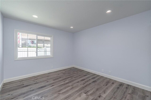 429 Somerset Cir, Corona, CA 92879 - empty room with wood finished floors, baseboards, and recessed lighting