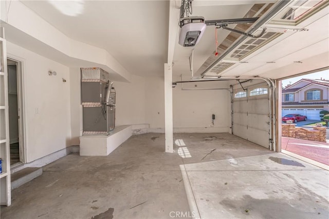429 Somerset Cir, Corona, CA 92879 - garage with a garage door opener and heating unit