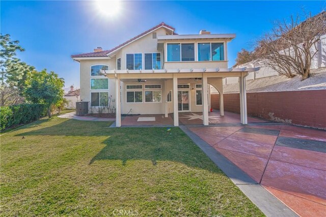 429 Somerset Cir, Corona, CA 92879 - back of property featuring a ceiling fan, stucco siding, a patio, and a chimney