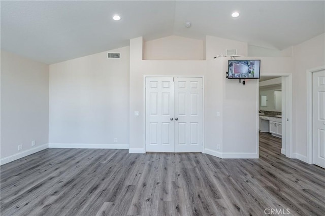 429 Somerset Cir, Corona, CA 92879 - unfurnished bedroom featuring vaulted ceiling, wood finished floors, baseboards, a closet, and recessed lighting