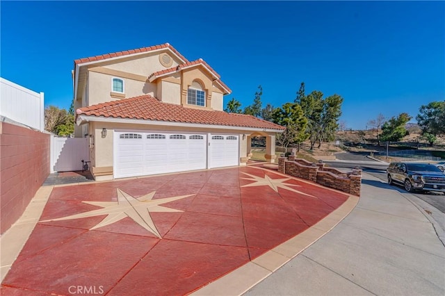 429 Somerset Cir, Corona, CA 92879 - mediterranean / spanish house with stucco siding, a tiled roof, and driveway