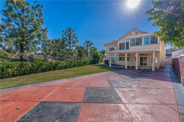 429 Somerset Cir, Corona, CA 92879 - rear view of property with stucco siding and a patio