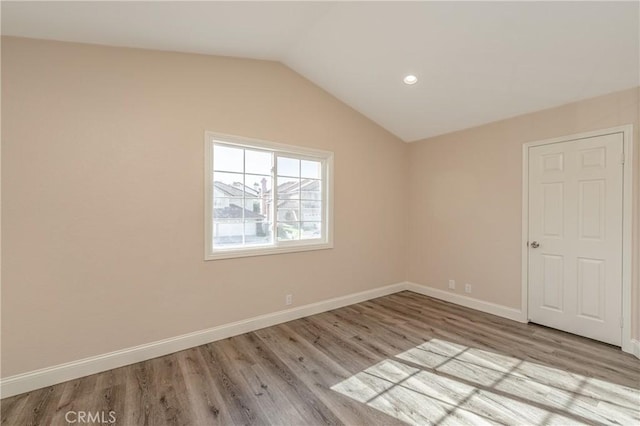 429 Somerset Cir, Corona, CA 92879 - unfurnished room featuring wood finished floors, vaulted ceiling, baseboards, and recessed lighting