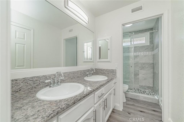 429 Somerset Cir, Corona, CA 92879 - full bath with toilet, a stall shower, double vanity, and wood finished floors