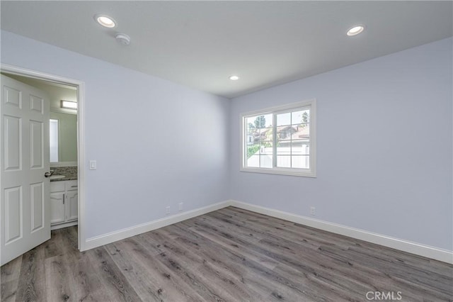 429 Somerset Cir, Corona, CA 92879 - empty room with wood finished floors, recessed lighting, baseboards, and a smoke detector