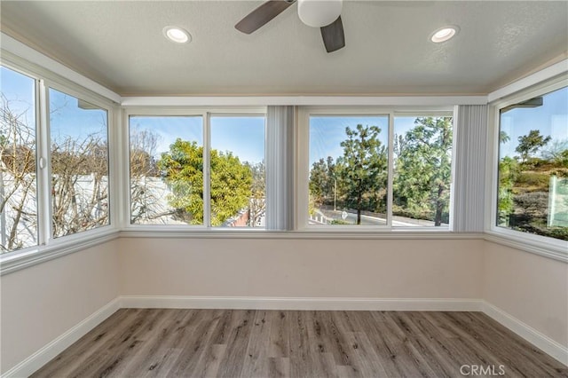 429 Somerset Cir, Corona, CA 92879 - unfurnished sunroom with baseboards, wood finished floors, healthy amount of natural light, recessed lighting, and a textured ceiling