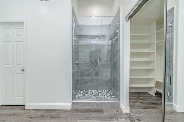 429 Somerset Cir, Corona, CA 92879 - full bathroom with a shower stall, wood finished floors, and baseboards