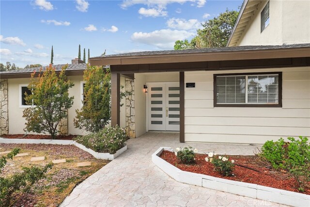 12635 Dorina Pl, Granada Hills, CA 91344 - property entrance with a garage