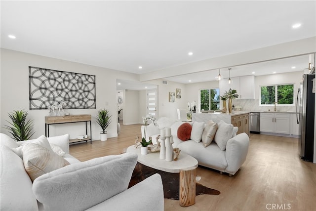 12635 Dorina Pl, Granada Hills, CA 91344 - living room with light wood-type flooring and recessed lighting