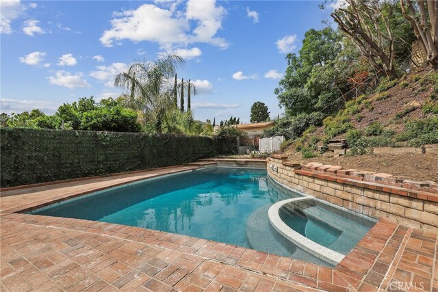 12635 Dorina Pl, Granada Hills, CA 91344 - view of swimming pool with a fenced backyard and a pool with connected hot tub