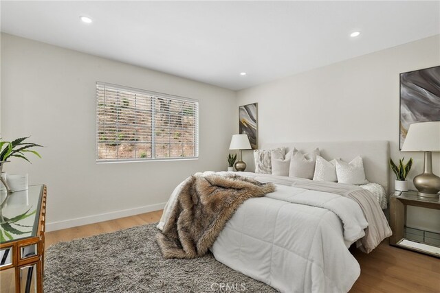 12635 Dorina Pl, Granada Hills, CA 91344 - bedroom featuring wood finished floors, recessed lighting, and baseboards