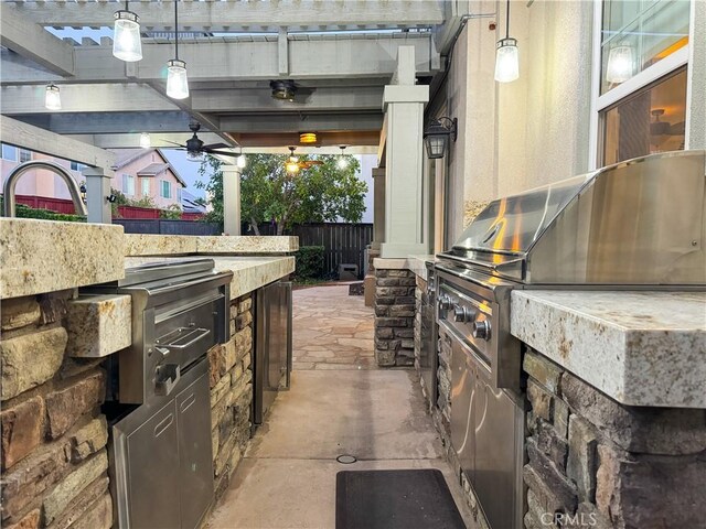 30304 Vercors St, Murrieta, CA 92563 - view of patio featuring exterior kitchen and fence