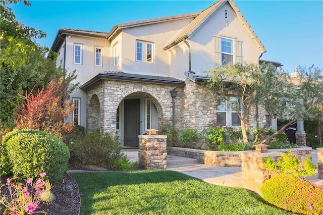 30304 Vercors St, Murrieta, CA 92563 - mediterranean / spanish-style house with stucco siding, stone siding, and a front yard