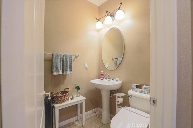30304 Vercors St, Murrieta, CA 92563 - bathroom featuring toilet, tile patterned flooring, a sink, and baseboards