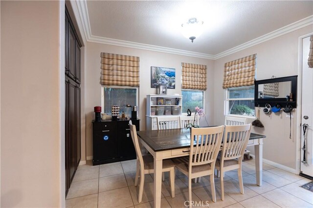 30304 Vercors St, Murrieta, CA 92563 - dining area with crown molding, light tile patterned floors, and baseboards
