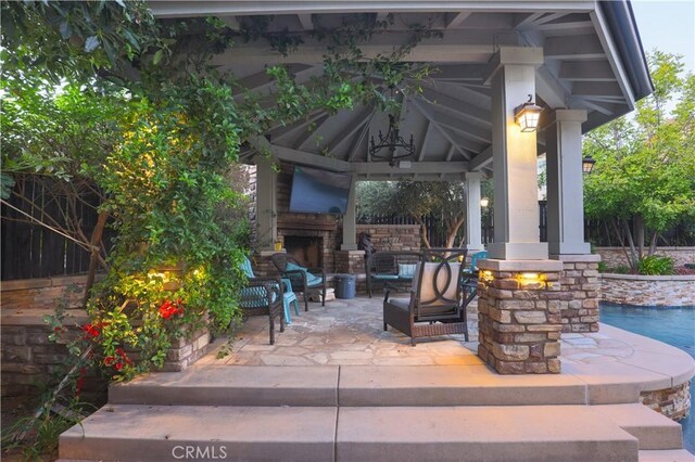 30304 Vercors St, Murrieta, CA 92563 - view of patio with a gazebo, fence, and an outdoor living space with a fireplace
