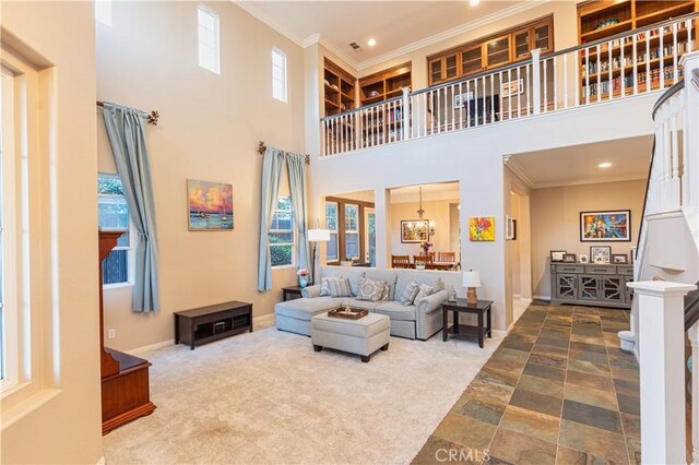 30304 Vercors St, Murrieta, CA 92563 - carpeted living room featuring ornamental molding, a high ceiling, recessed lighting, a chandelier, and baseboards