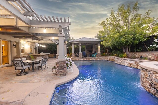 30304 Vercors St, Murrieta, CA 92563 - swimming pool featuring a gazebo, a patio area, ceiling fan, an outdoor kitchen, and outdoor dining space