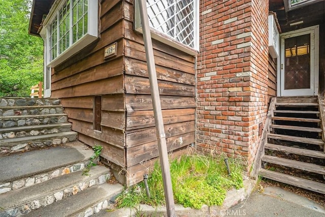 exterior space featuring brick siding