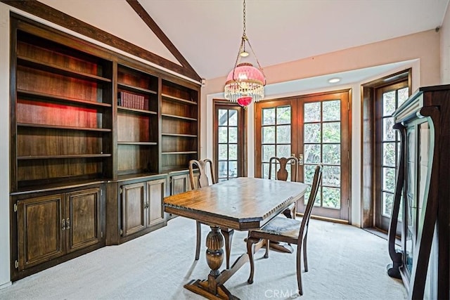 419 Lytle Ln, Lytle Creek, CA 92358 - dining space with vaulted ceiling, light colored carpet, french doors, and a chandelier