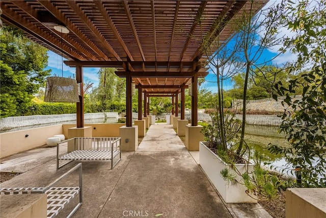 view of patio / terrace with a pergola and fence
