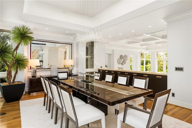 dining room with wood finished floors, recessed lighting, a chandelier, and ornamental molding