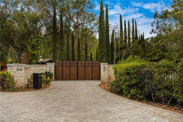 view of gate featuring fence