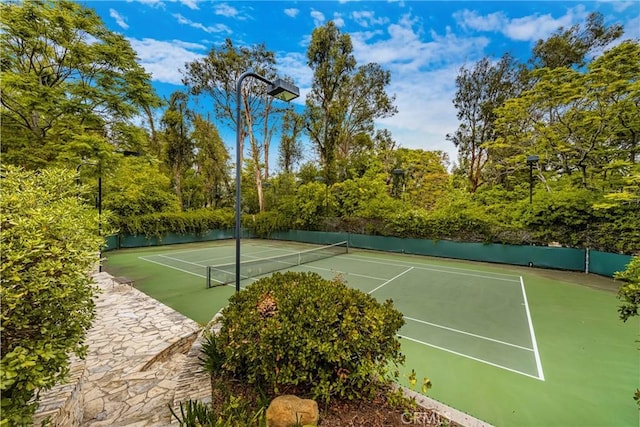 view of sport court featuring fence and community basketball court