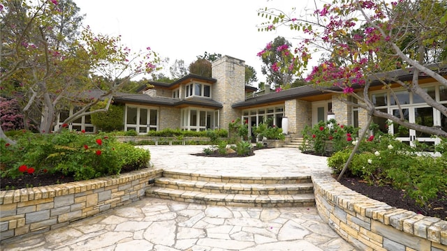 back of property featuring a chimney