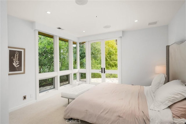 carpeted bedroom with baseboards, french doors, visible vents, and recessed lighting