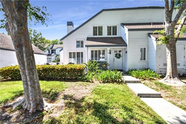 85 Briarglen, Irvine, CA 92614 - view of front facade with a chimney, roof with shingles, and a front lawn
