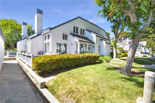 85 Briarglen, Irvine, CA 92614 - view of front of house featuring a front yard and a chimney