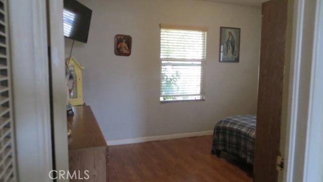 506 N Sunset Ave, Azusa, CA 91702 - bedroom featuring wood finished floors and baseboards