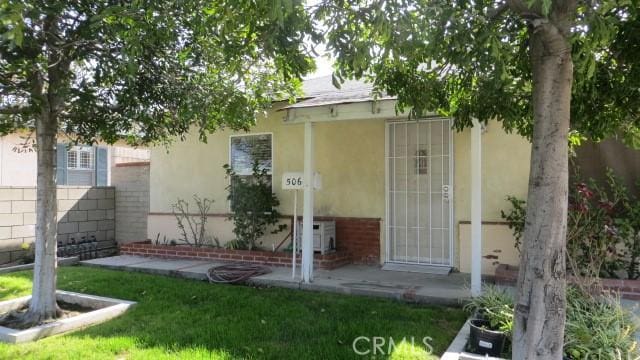 506 N Sunset Ave, Azusa, CA 91702 - doorway to property with stucco siding