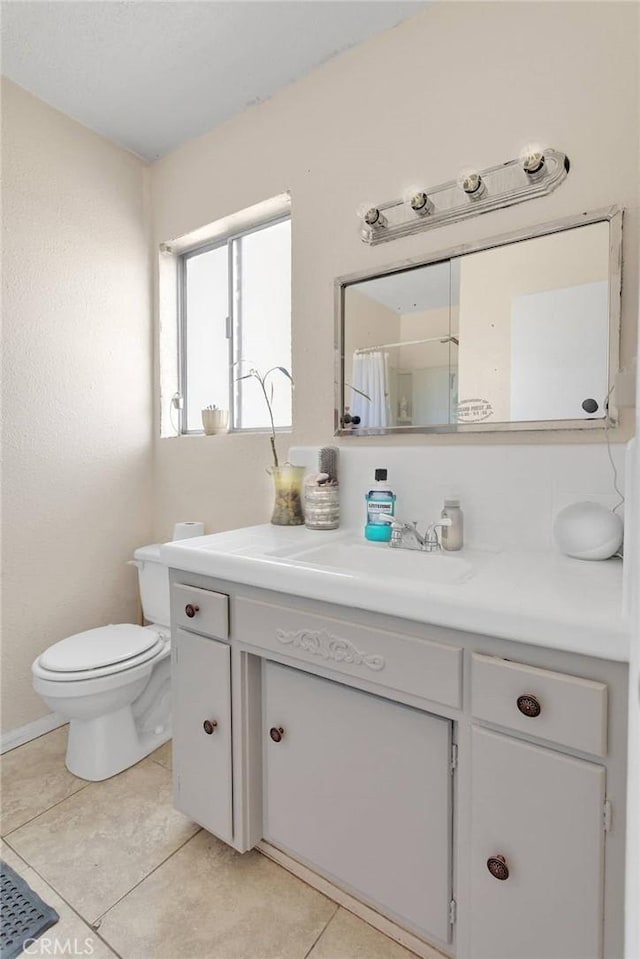 9415 Yucca St, Apple Valley, CA 92308 - full bath featuring tile patterned flooring, toilet, and vanity
