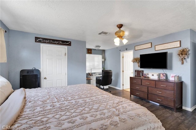 9415 Yucca St, Apple Valley, CA 92308 - bedroom with baseboards, visible vents, a textured ceiling, and dark wood finished floors