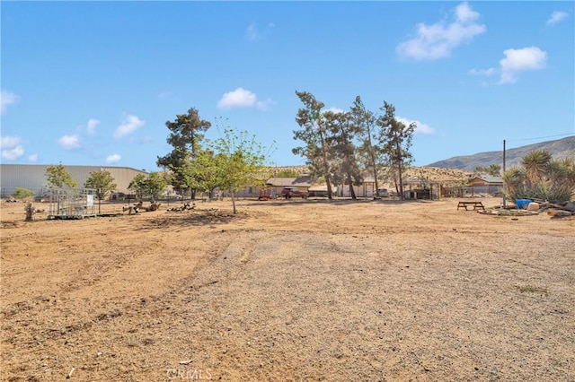 9415 Yucca St, Apple Valley, CA 92308 - view of yard featuring fence and a mountain view
