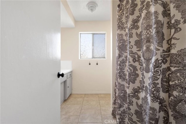 9415 Yucca St, Apple Valley, CA 92308 - bathroom with tile patterned flooring, baseboards, a shower with curtain, and vanity