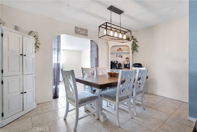 9415 Yucca St, Apple Valley, CA 92308 - dining room featuring arched walkways and light tile patterned flooring