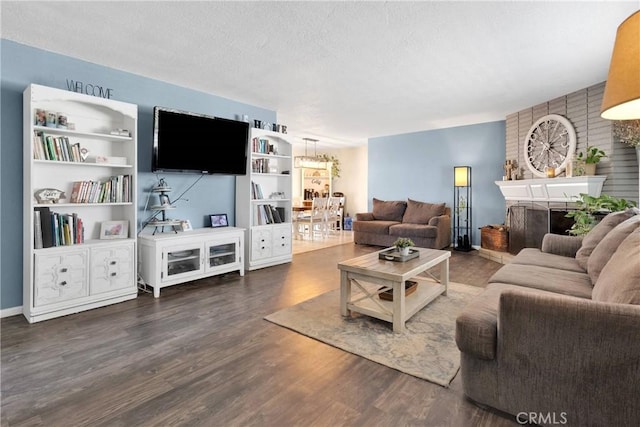 9415 Yucca St, Apple Valley, CA 92308 - living area with a brick fireplace, wood finished floors, and a textured ceiling