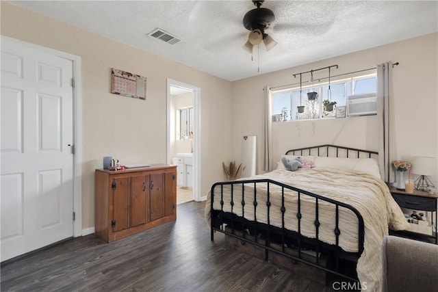 9415 Yucca St, Apple Valley, CA 92308 - bedroom with a textured ceiling, baseboards, visible vents, wood finished floors, and ensuite bath