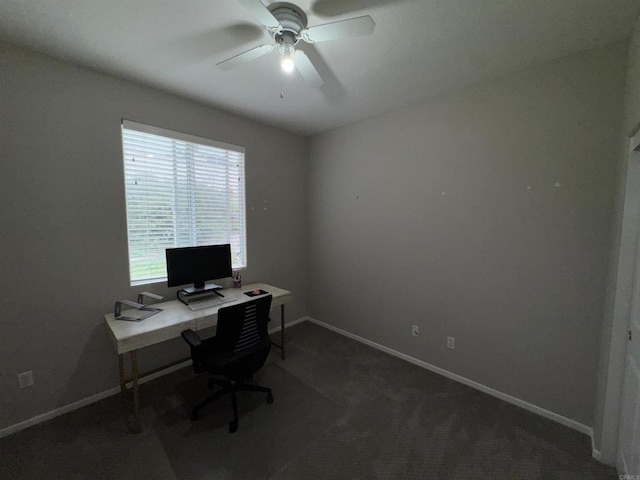 carpeted office with baseboards and ceiling fan