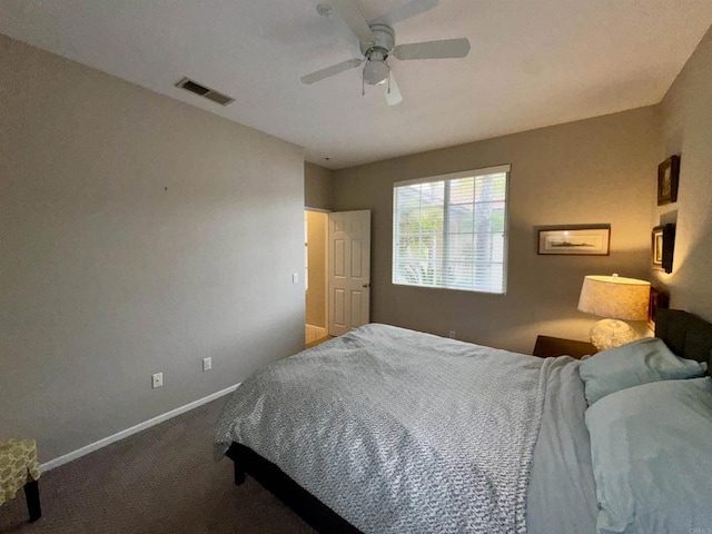 bedroom with visible vents, a ceiling fan, baseboards, and carpet flooring