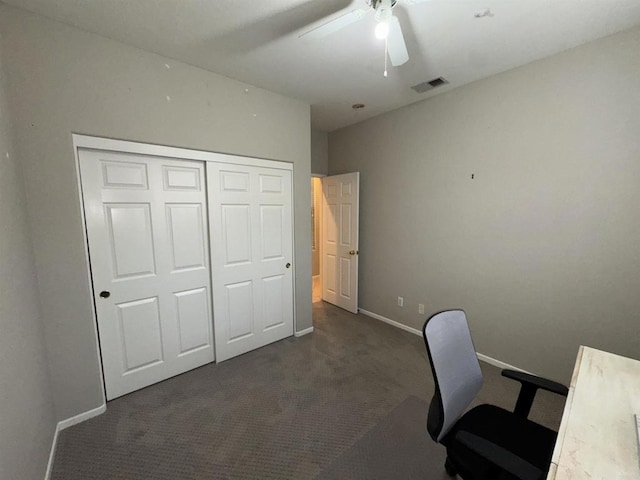 office with dark colored carpet, visible vents, baseboards, and ceiling fan