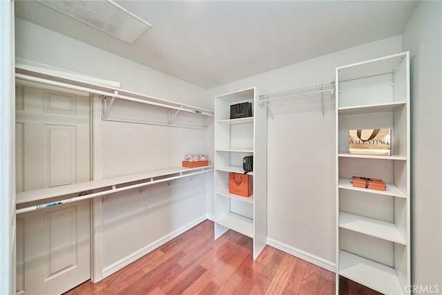 spacious closet with wood finished floors