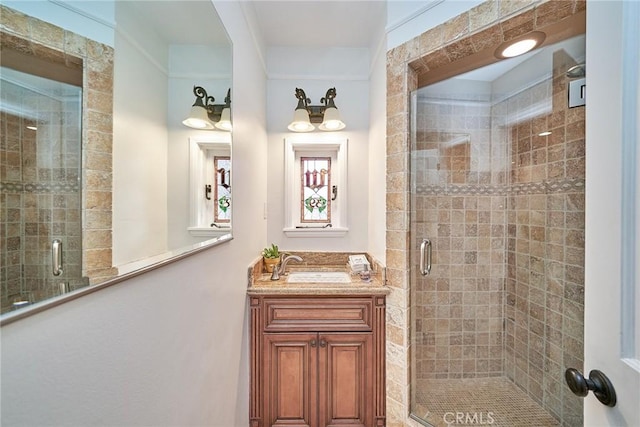 bathroom featuring vanity and a shower stall